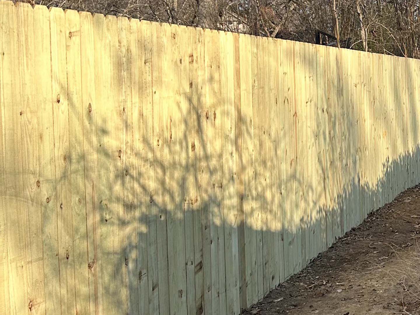 Brenham TX stockade style wood fence