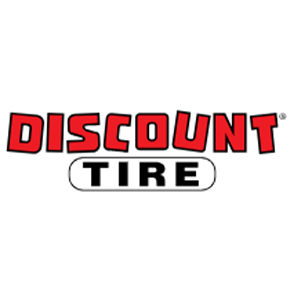 The logo for Discount Tire features the word DISCOUNT in bold red letters above the word TIRE in bold black letters inside a white oval with a black outline. The background is white.